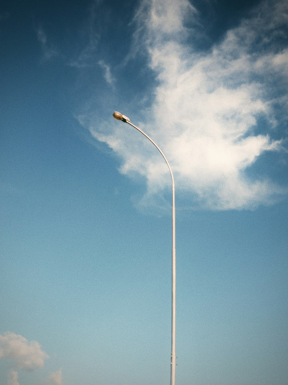 a street light in the middle of a parking lot