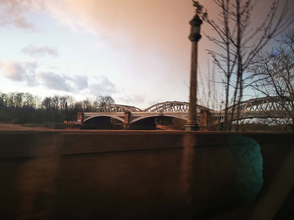 a view of a bridge from a moving vehicle