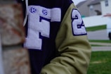Close-up of a custom jacket with embroidered logos and player names.
