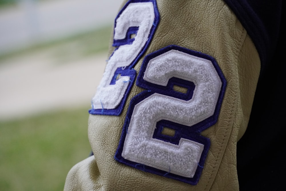 a close up of a person wearing a jacket with numbers on it