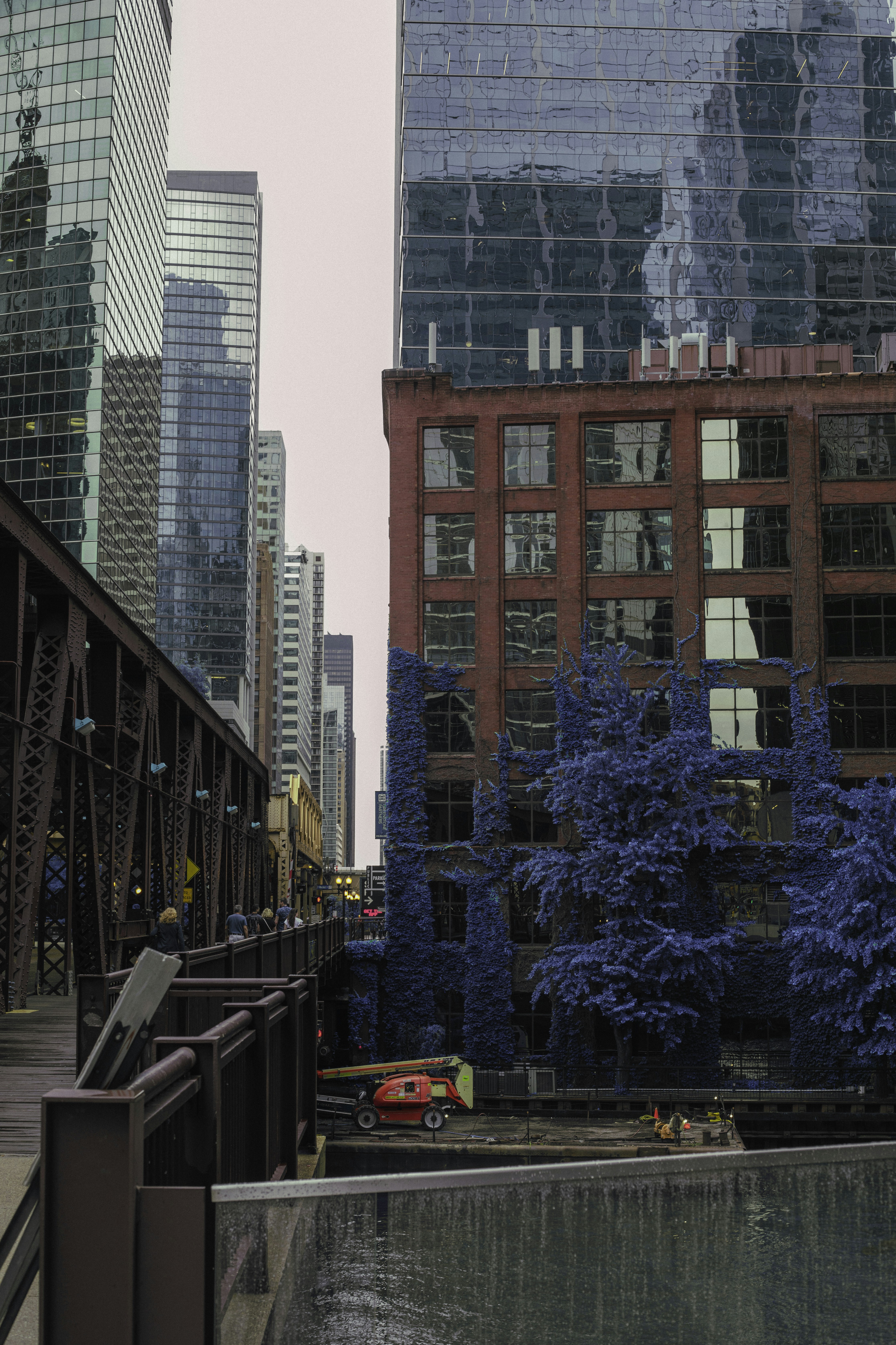 a city with tall buildings next to a body of water