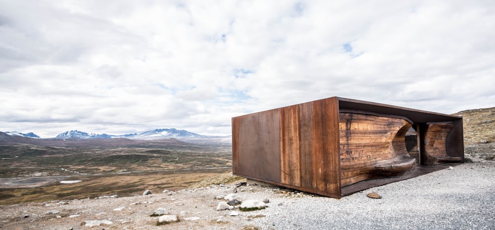 a wooden structure sitting on top of a mountain