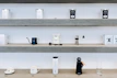 Various coffee accessories including grinders and filters arranged neatly