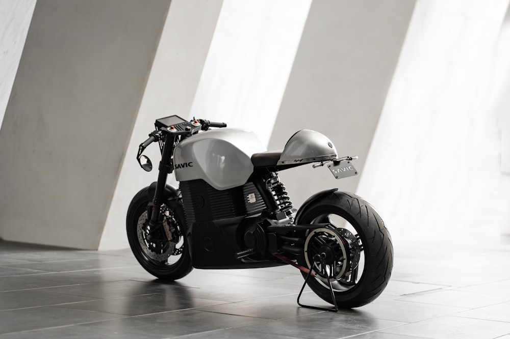 a black and white motorcycle parked in a room