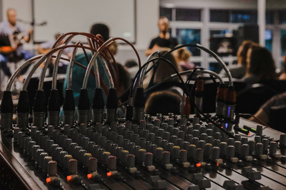 a sound board with a lot of knobs on it