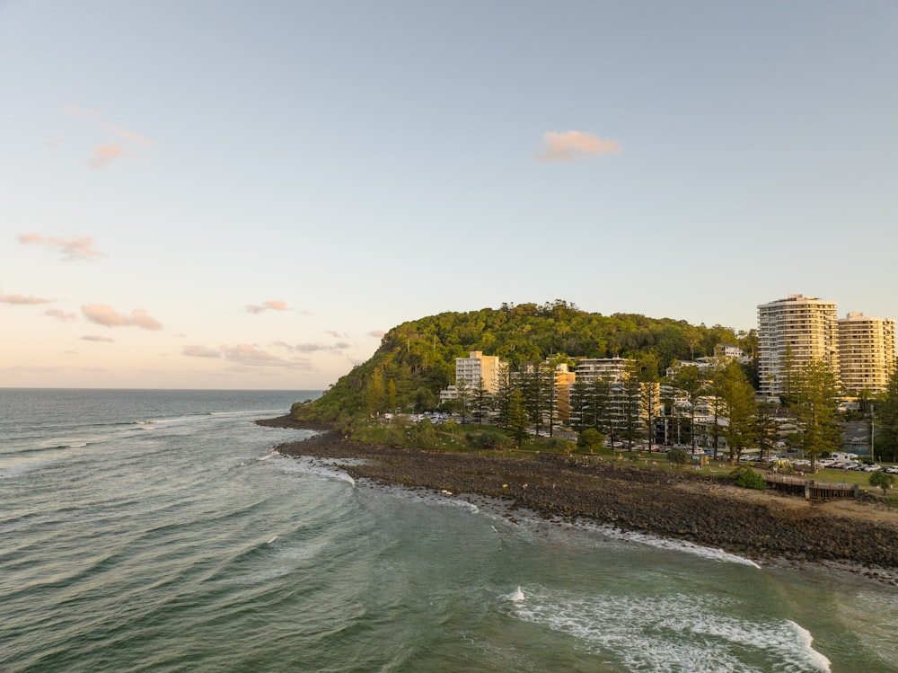 a view of a beach with a city in the background