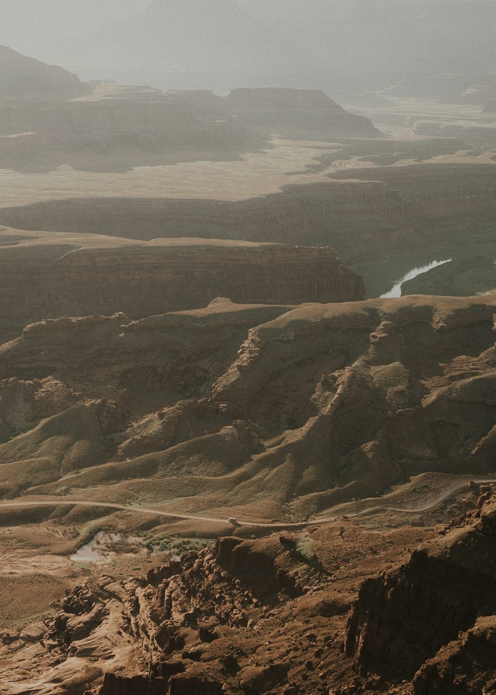 a view of a valley with a river running through it