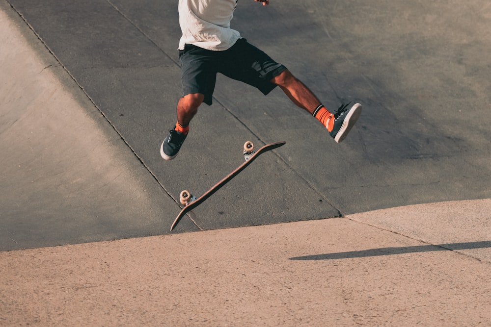 a man flying through the air while riding a skateboard