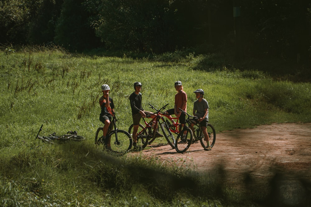 a group of people standing next to each other on bikes