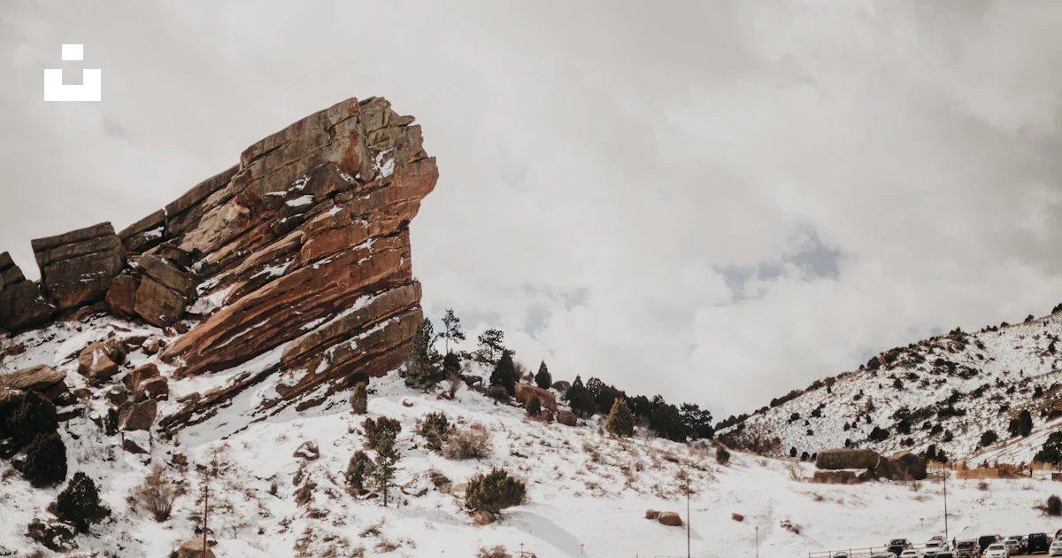 Snow Landscape With Rocks A large rock formation in the middle of a snowy landscape photo – Free ...