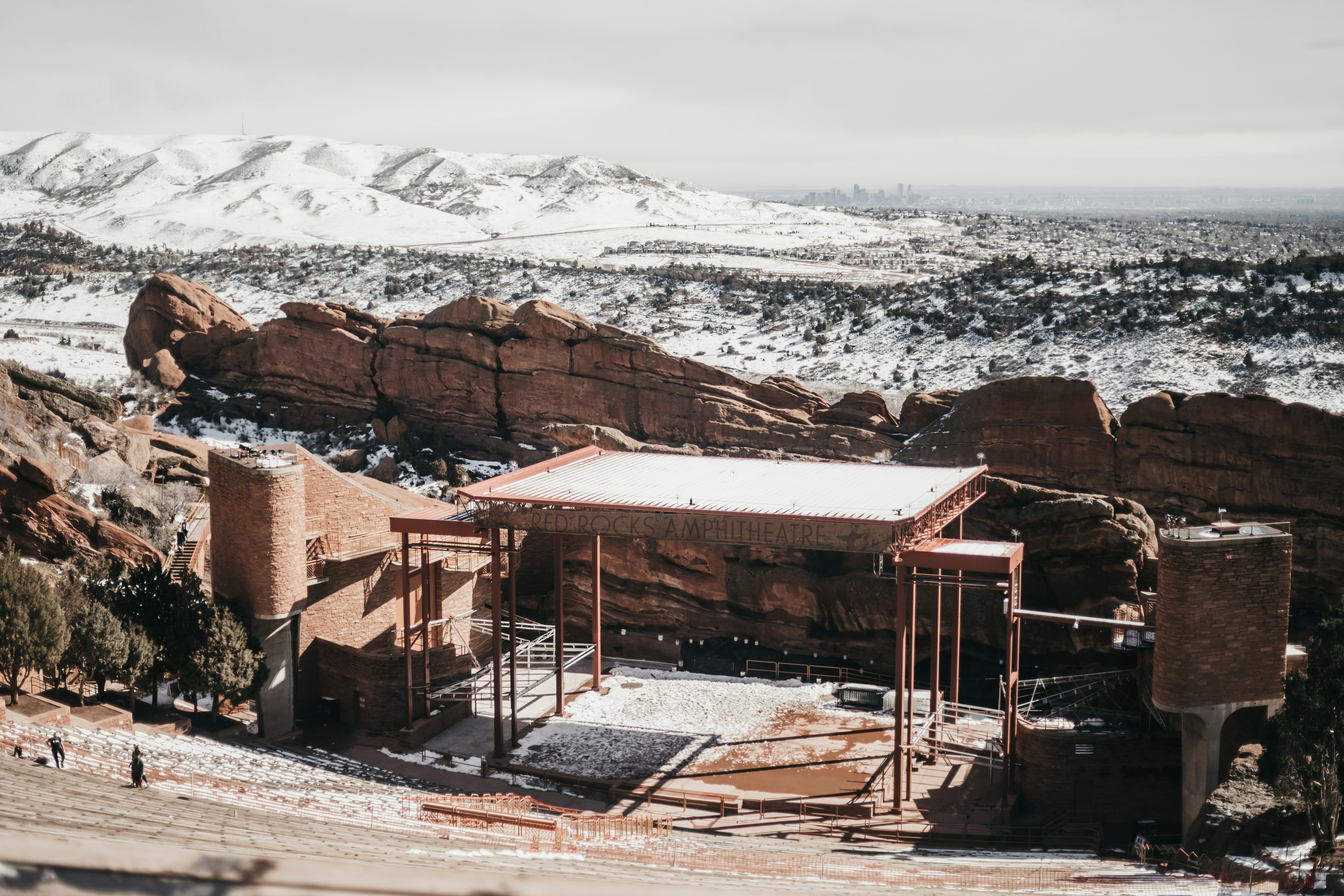 a small building sitting on top of a snow covered mountain