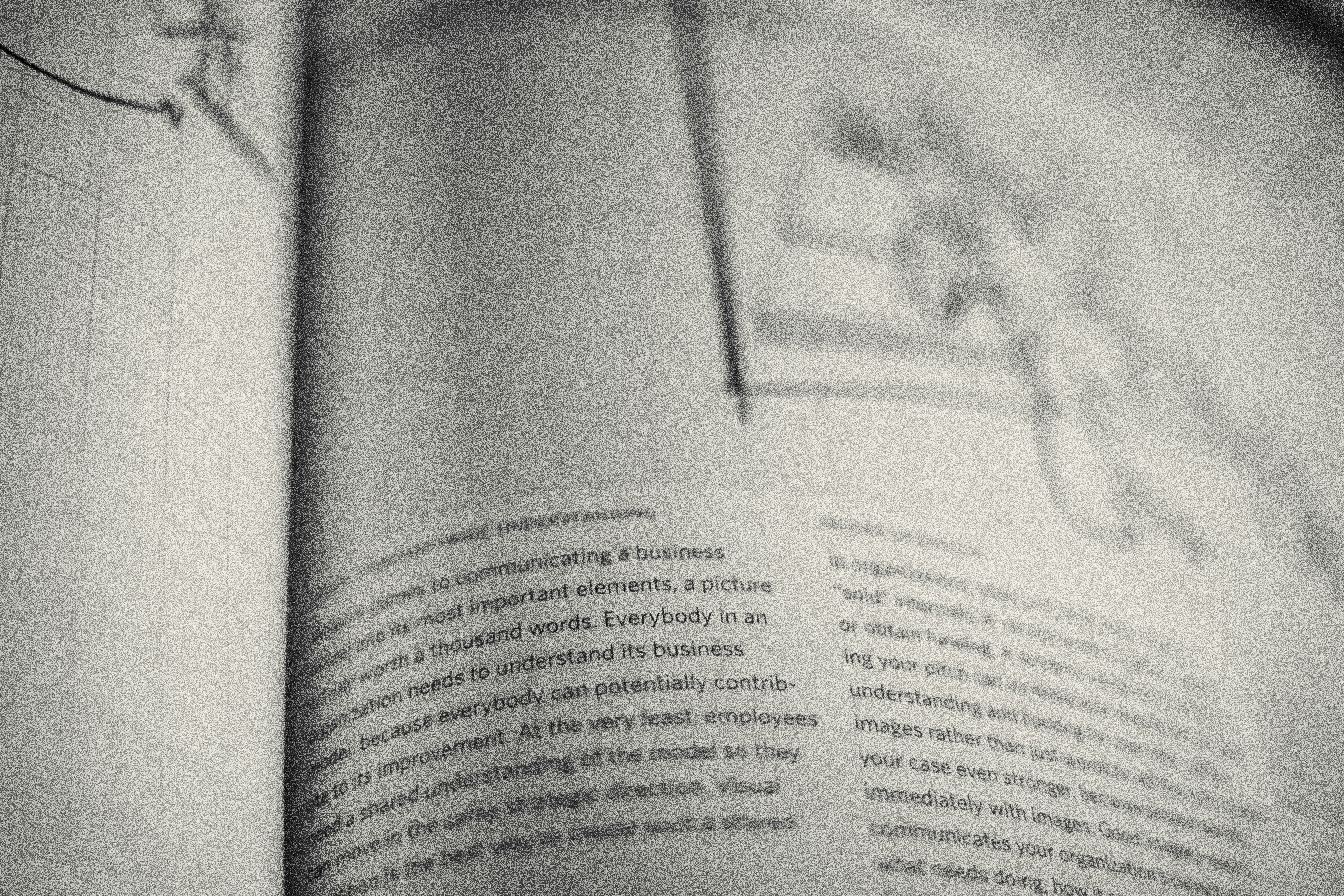 a close up of an open book with writing on it