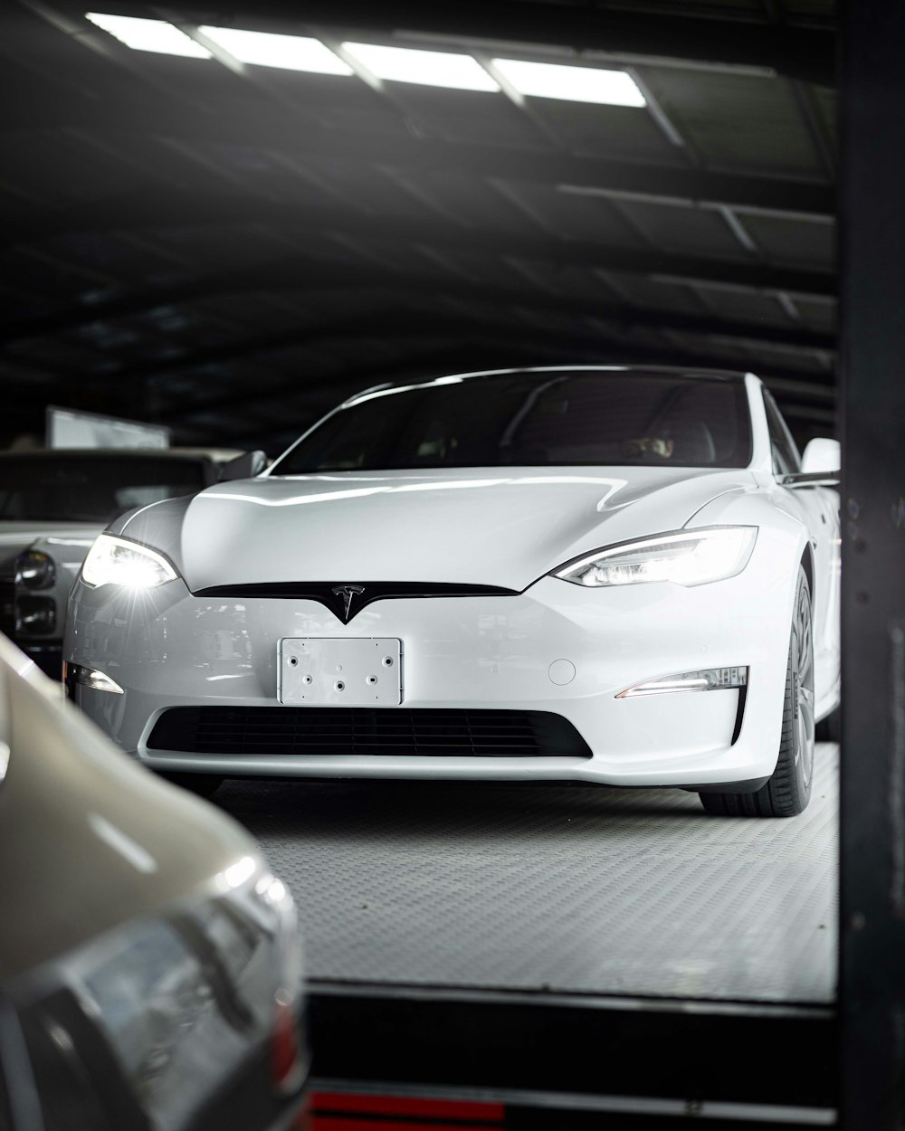 a white car is parked in a garage