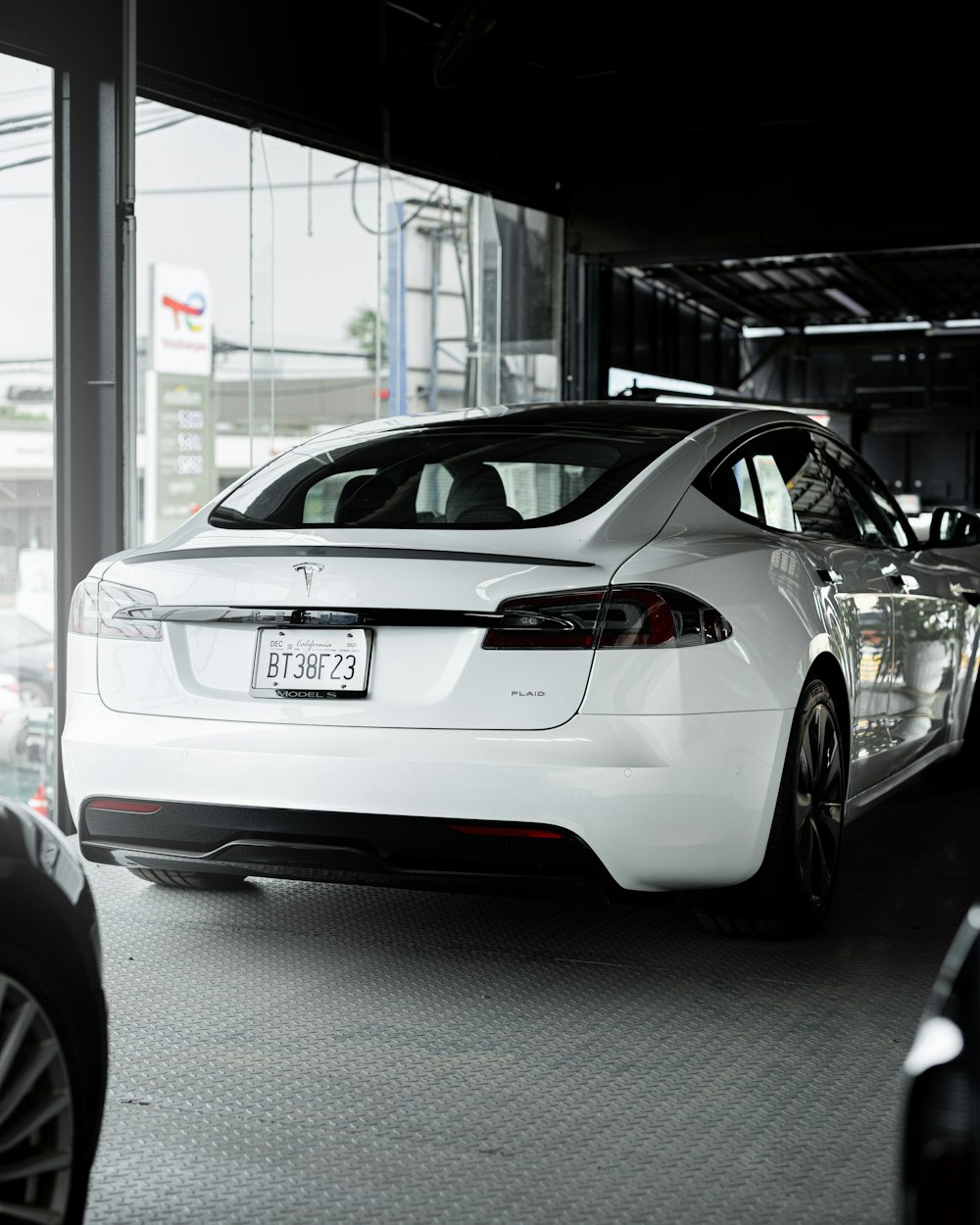 a white car is parked in a garage