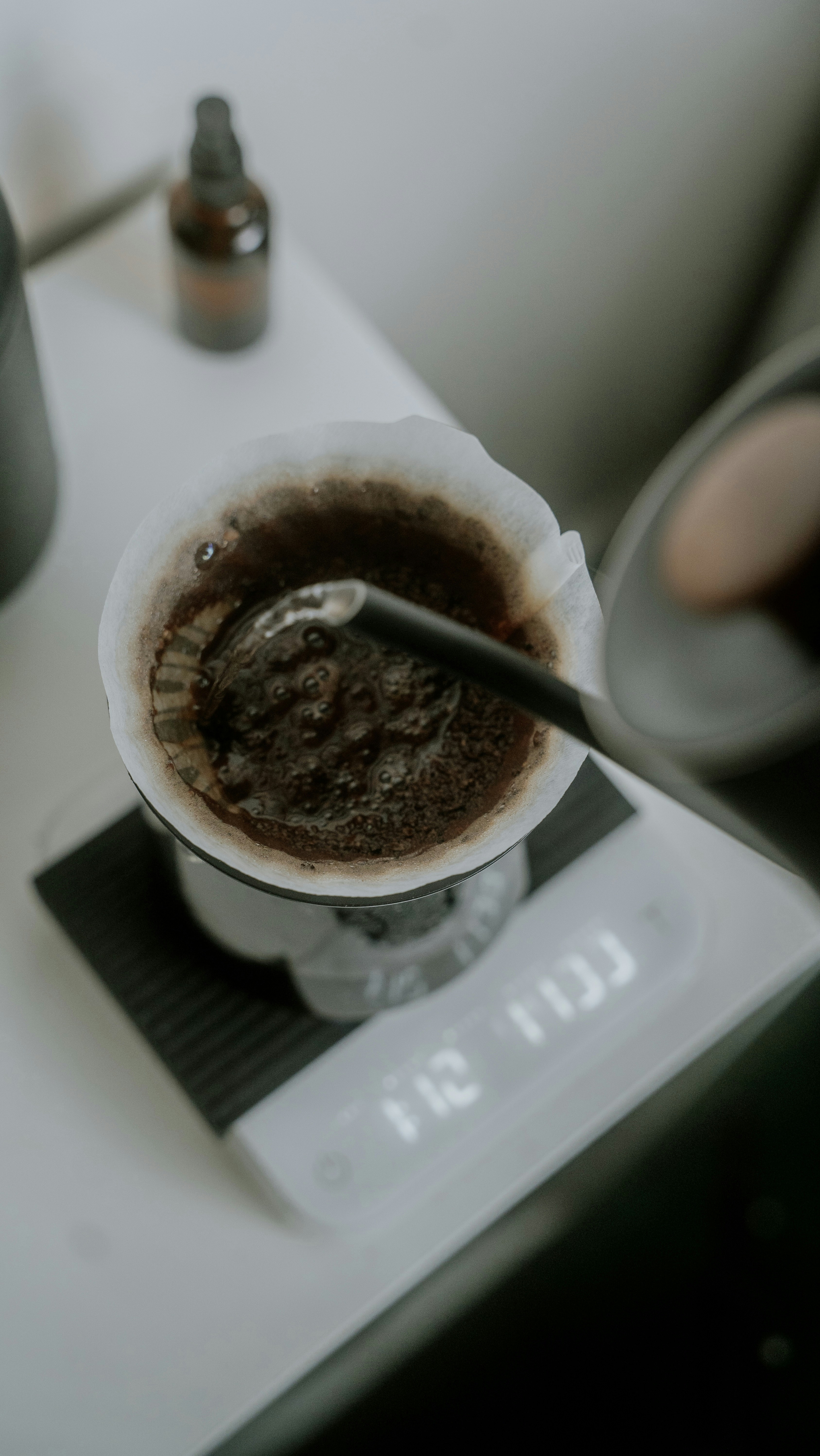 a cup of coffee sitting on top of a scale