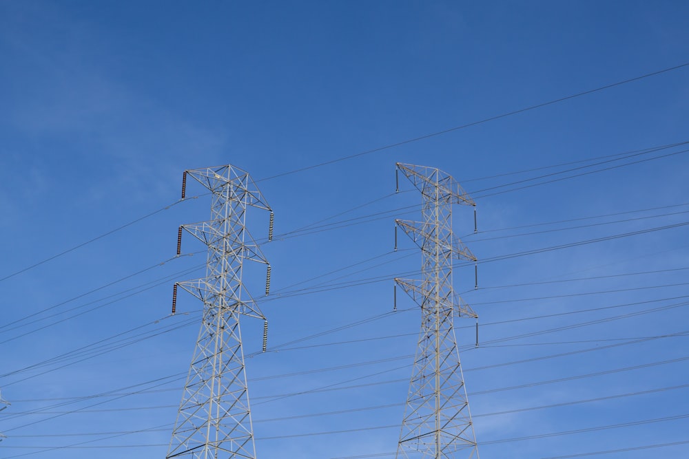 a row of power lines against a blue sky