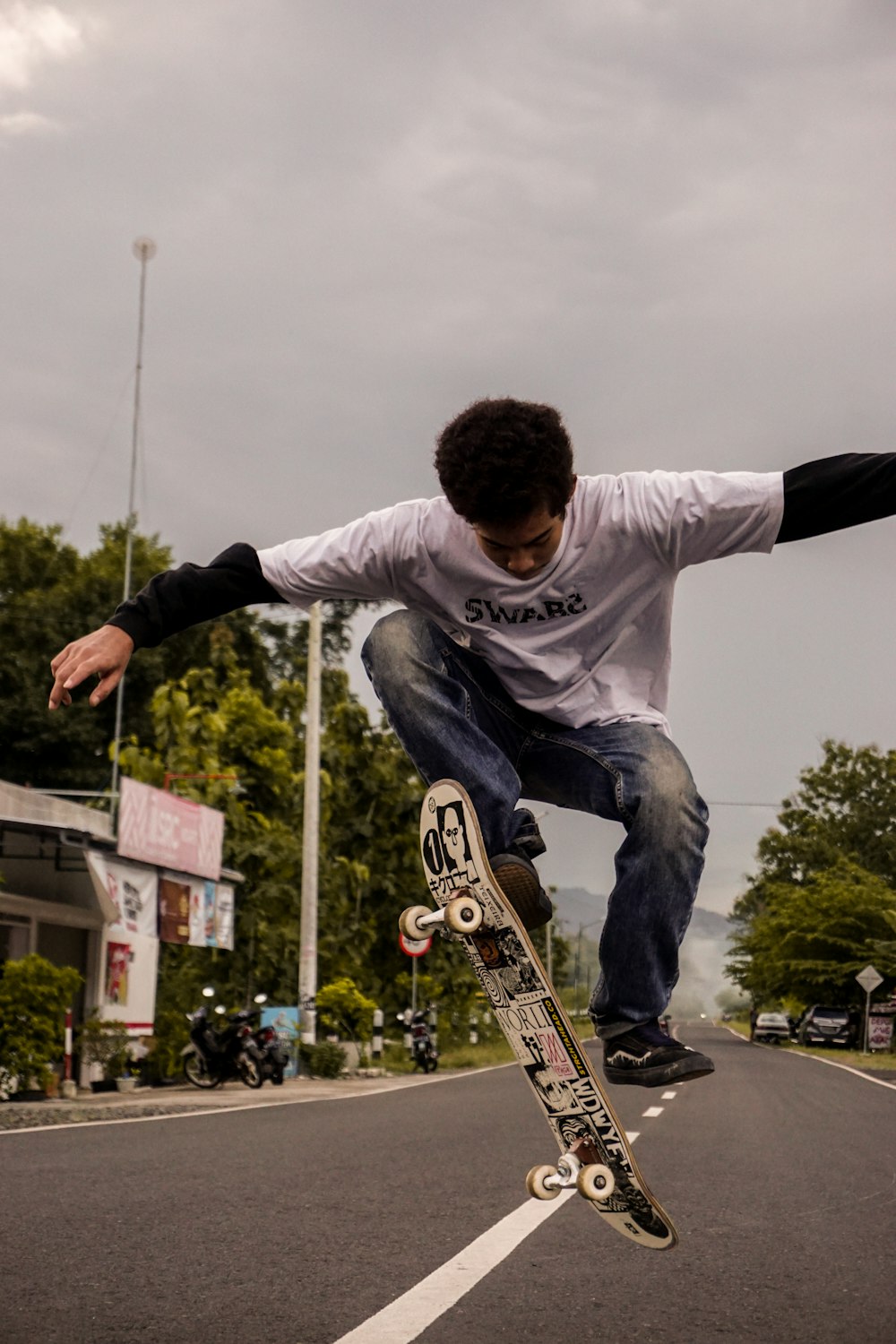 a man flying through the air while riding a skateboard