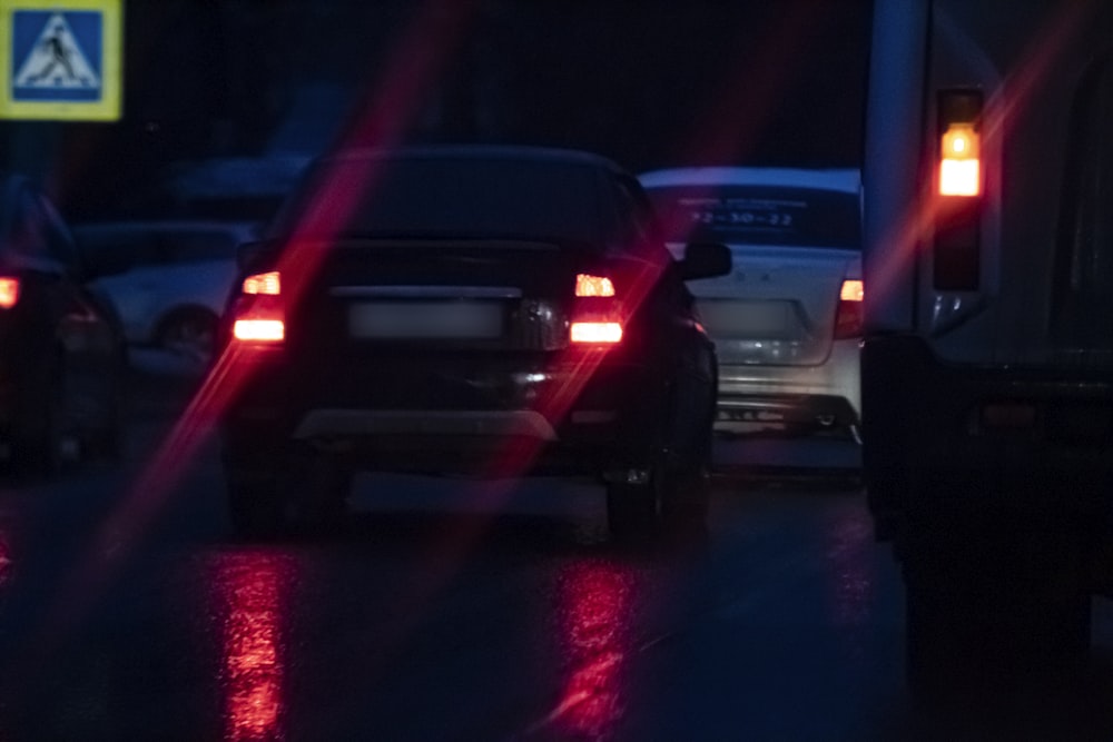 a couple of cars that are sitting in the street