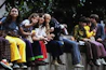 a group of people sitting next to each other