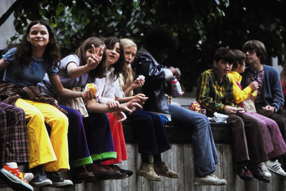 a group of people sitting next to each other