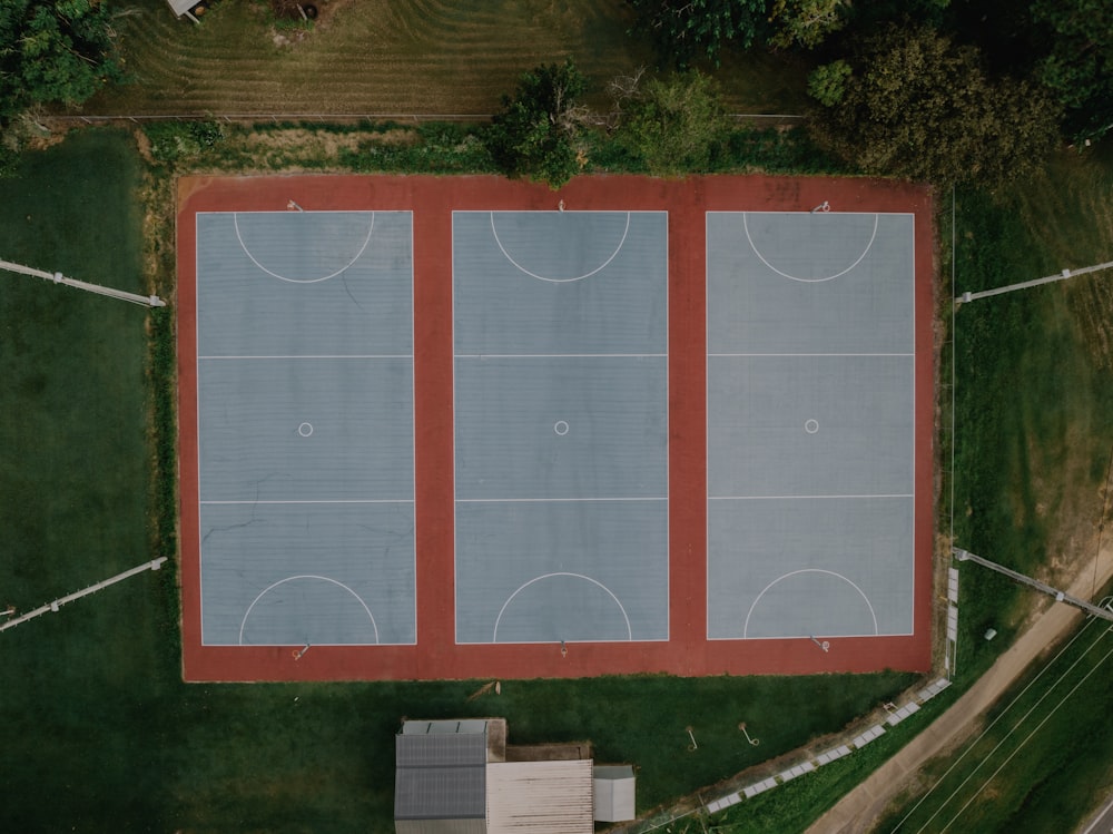 an aerial view of a basketball court in the middle of a field