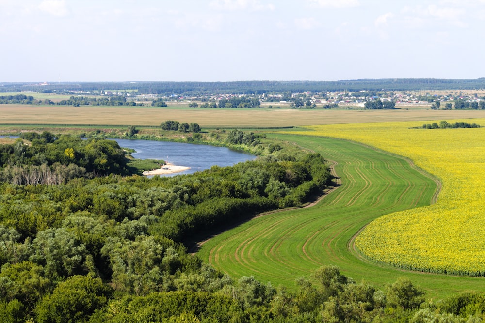 a river running through a lush green countryside