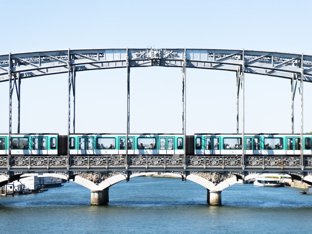 a train on a bridge over a body of water