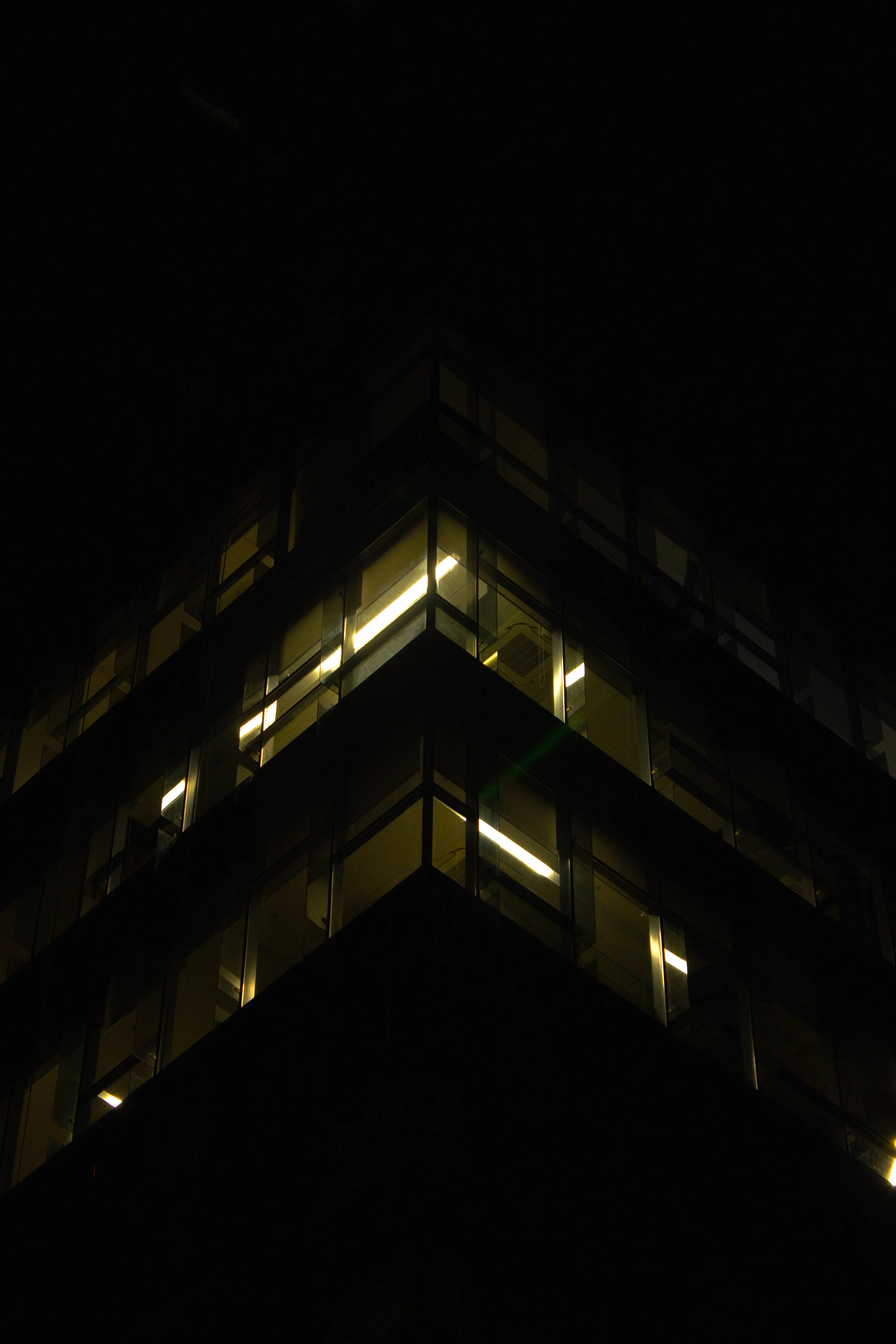 a very tall building lit up at night