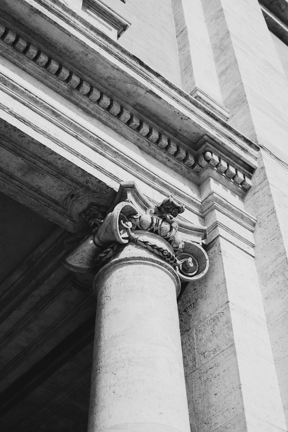 a black and white photo of a building with columns