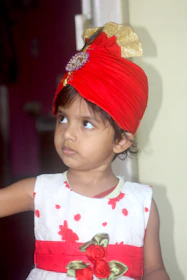 Cute kids' panjabi and pajama sets arranged with playful accessories.