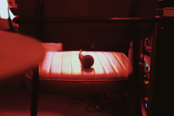 Recording booth with a microphone set up for voice-over sessions, softly lit.