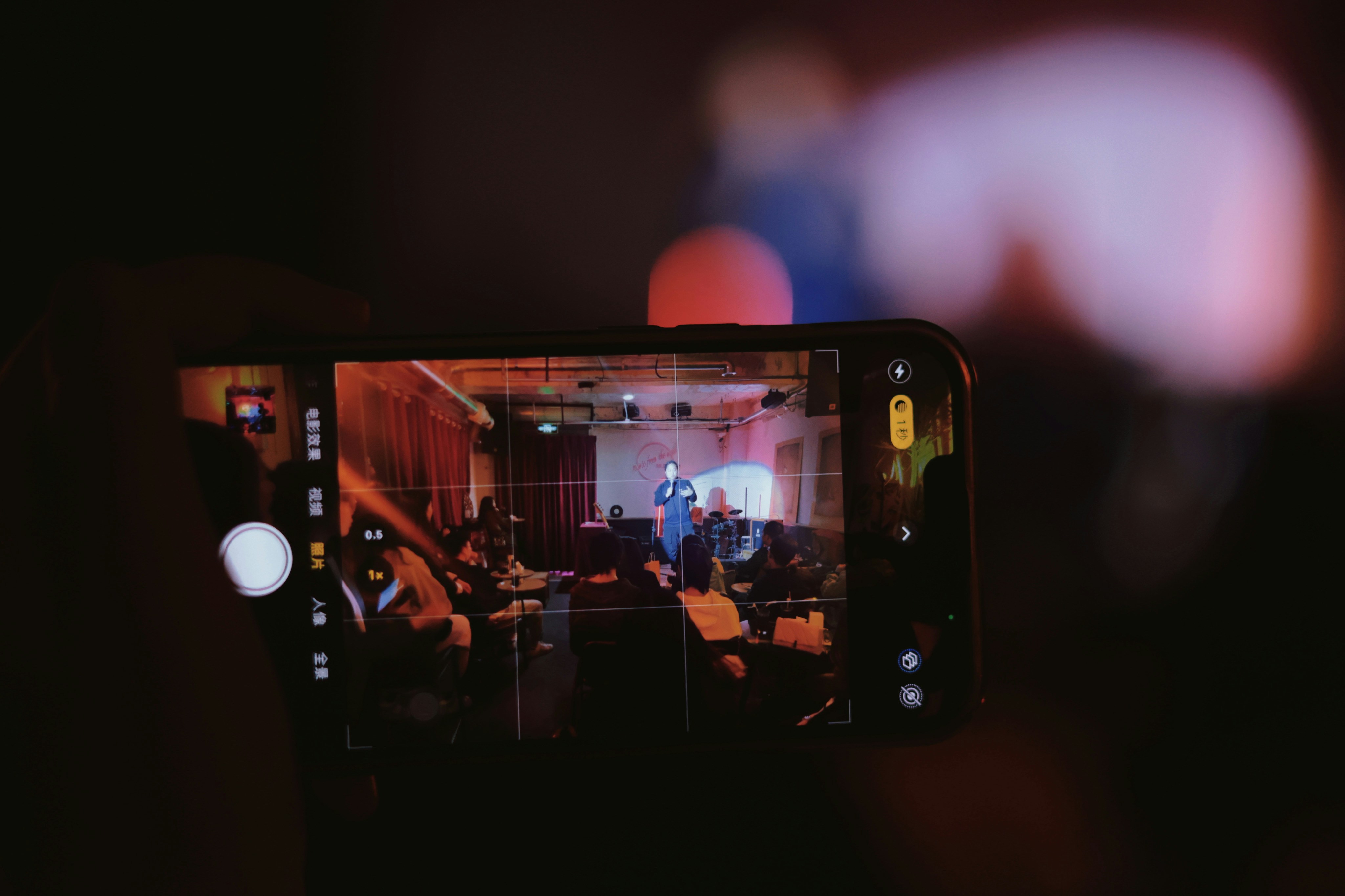 a person taking a picture of a group of people