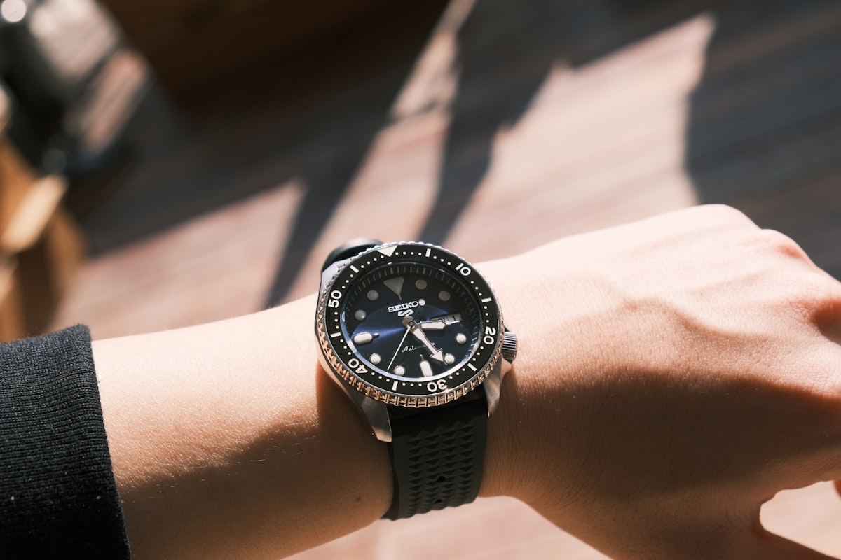 Dive watch photographed in a water context showing bezel and dial