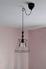 a light hanging from a ceiling in a room