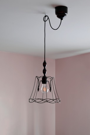 a light hanging from a ceiling in a room