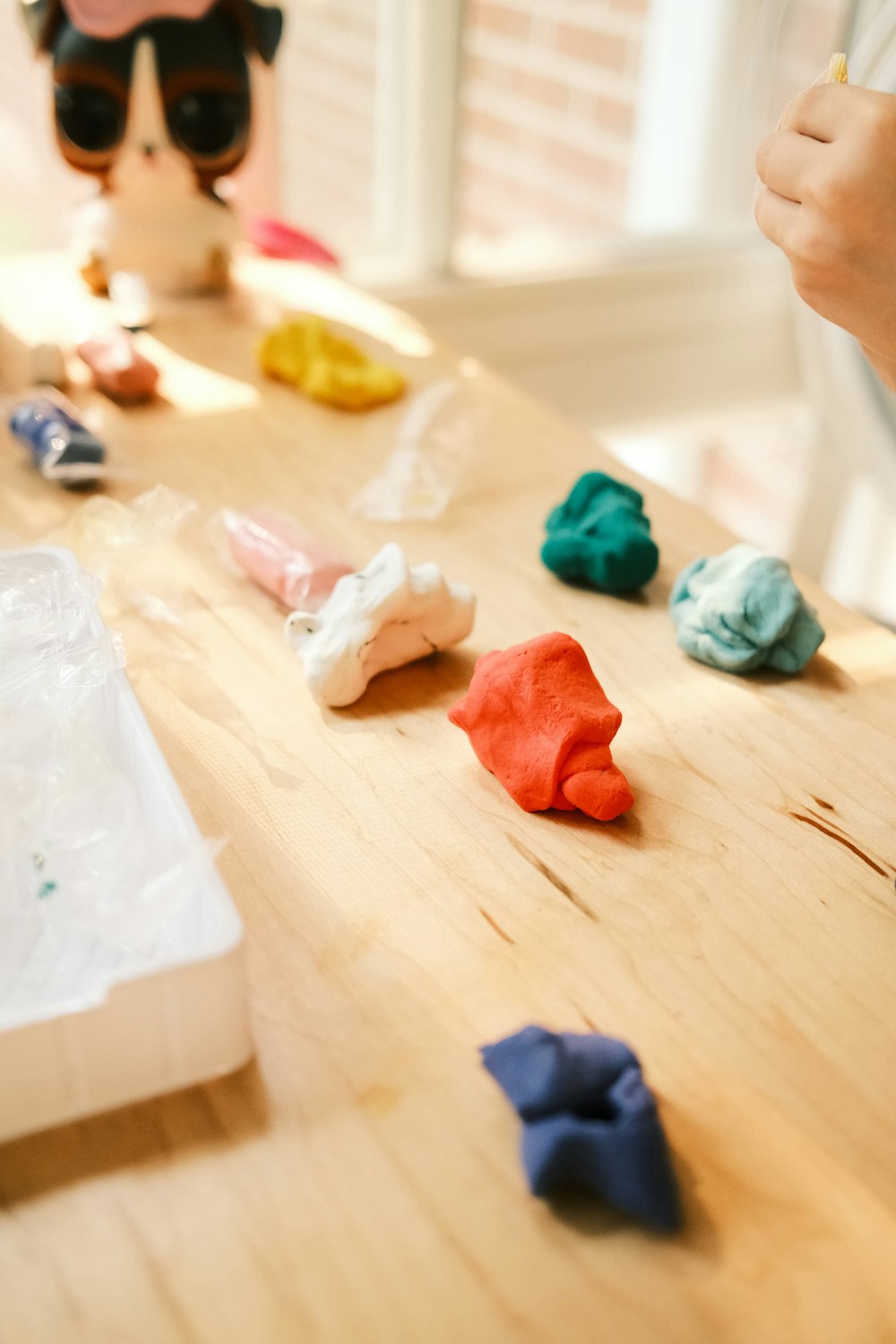 a wooden table topped with lots of different colored items