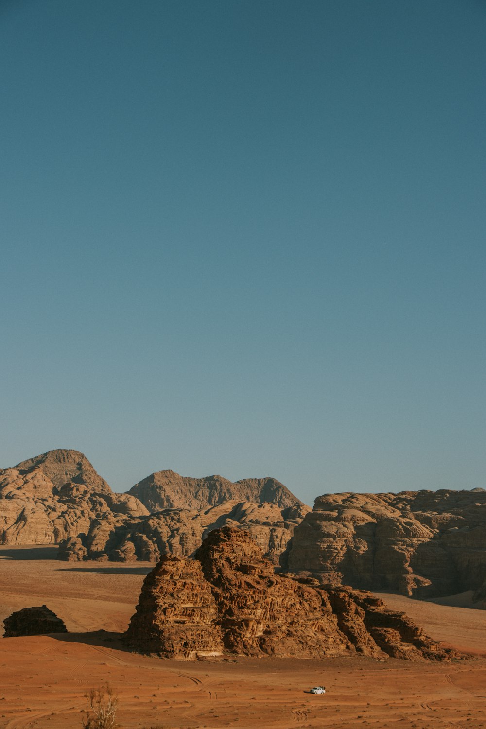 a desert landscape with mountains in the background