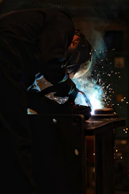 a welder working on a piece of metal