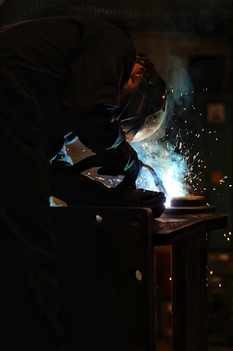 a welder working on a piece of metal
