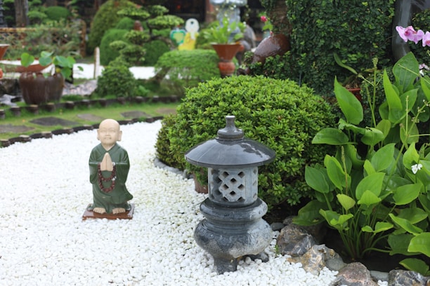 A serene scene of a monk guiding a Zen meditation session in a tranquil garden.
