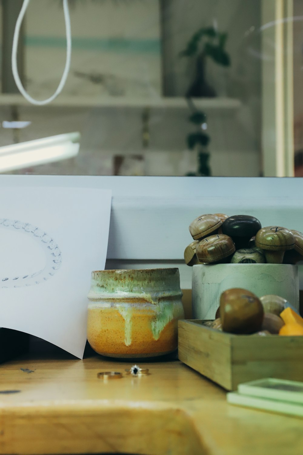 a wooden table topped with jars filled with fruit