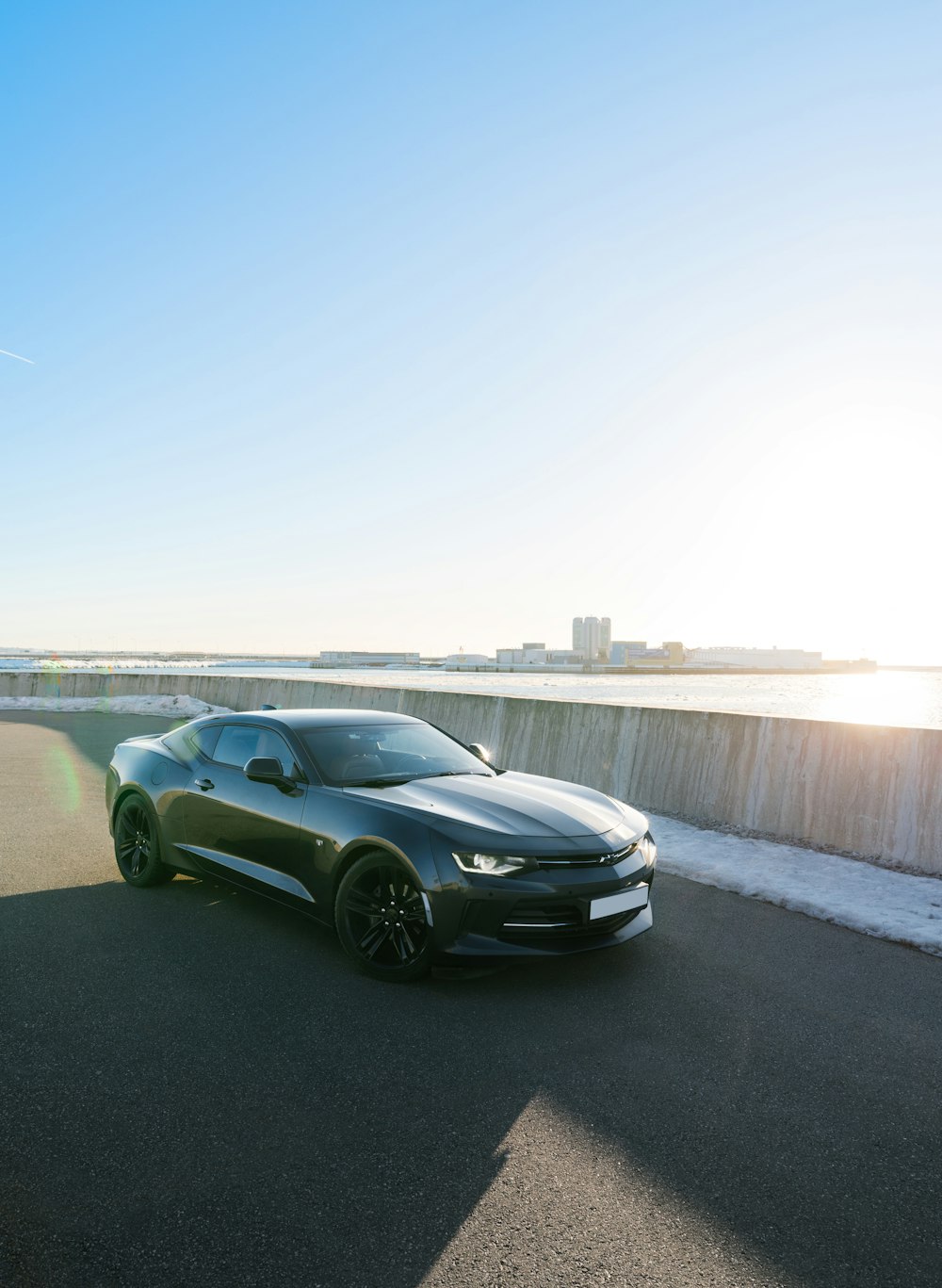 a black sports car parked on the side of the road