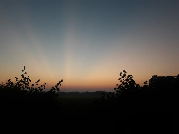 A serene twilight landscape symbolizing the transition between life and afterlife.