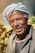 an old man with a turban on his head