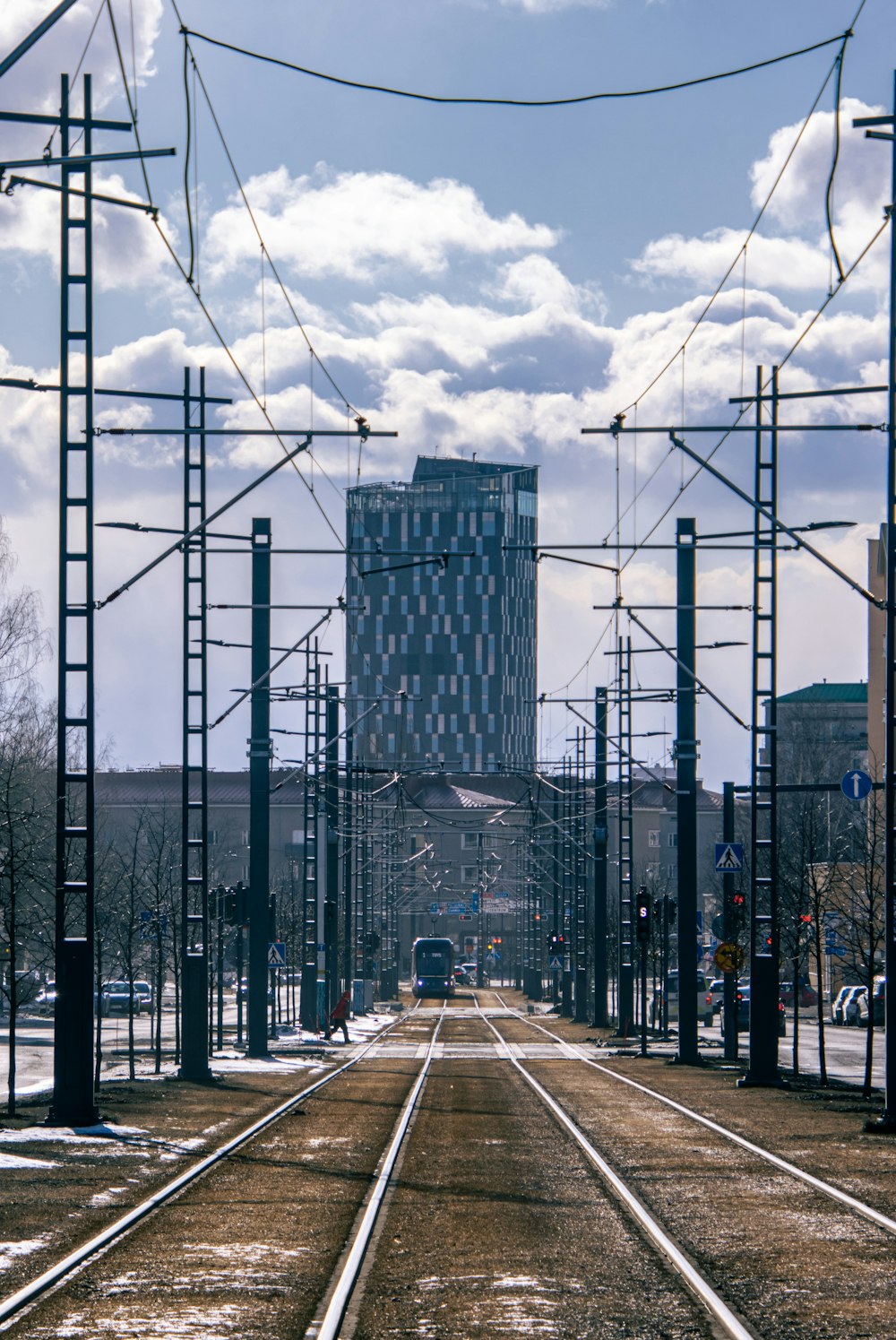 a train track with a building in the background