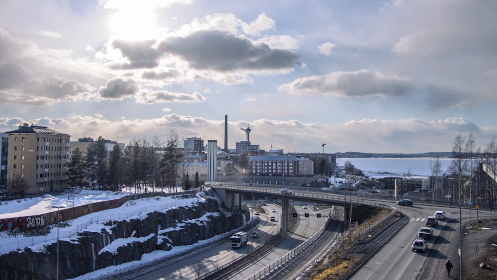 a view of a bridge over a snowy road