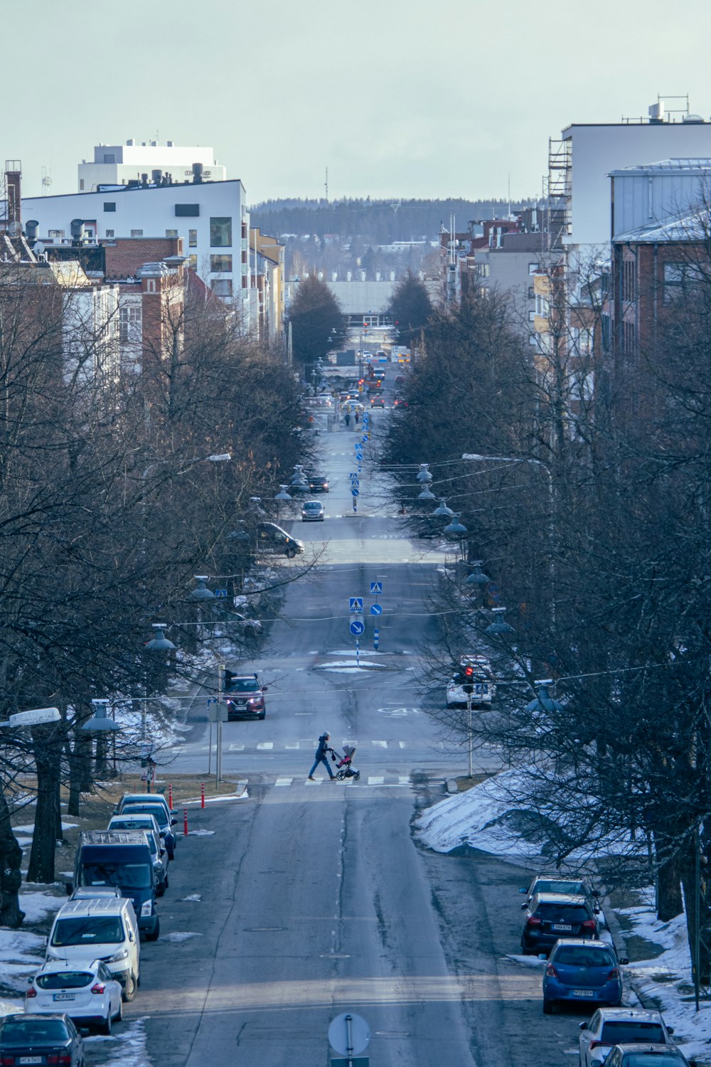 a street with cars parked on both sides of it