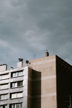 An apartment building's rooftop showcasing fiber-optic cables being installed.