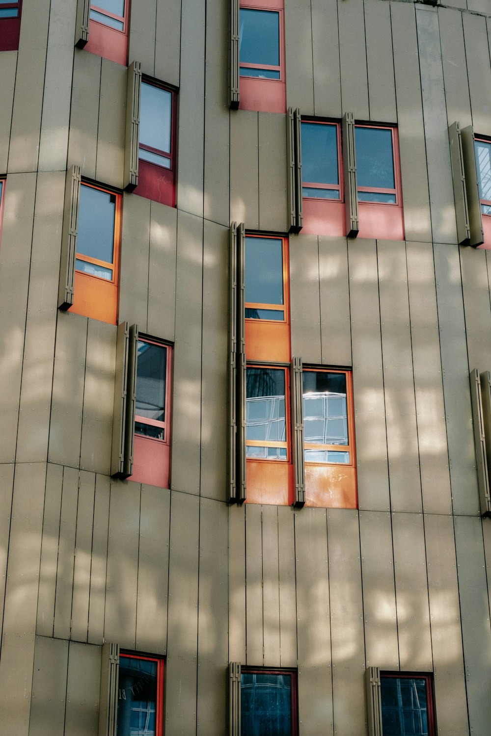 a tall building with many windows and a clock