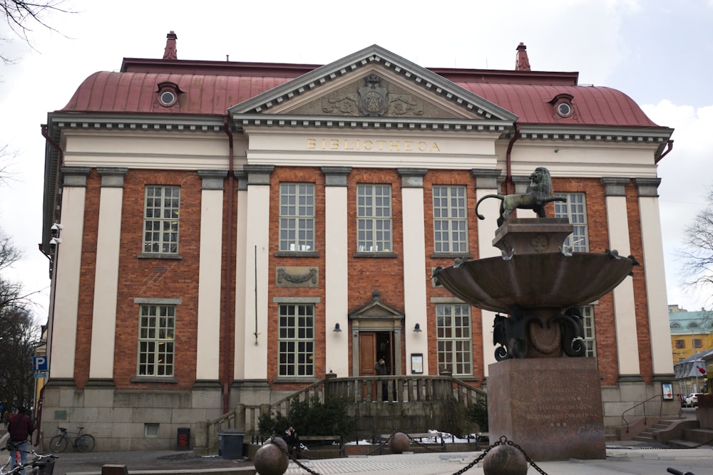 a building with a fountain in front of it